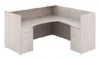 L shaped reception desk with white glass transaction counter