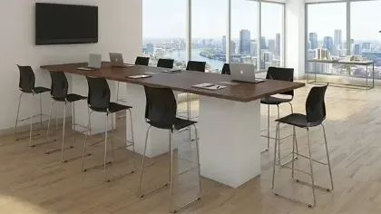 Cafe height conference table with white cube bases, laminate top, and wire management grommets