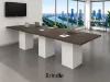 Cafe height conference table with white cube bases, laminate top, and wire management grommets
