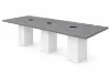 Cafe height conference table with white cube bases, laminate top, and wire management grommets