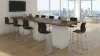 Cafe height conference table with white cube bases, laminate top, and wire management grommets