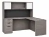 L-shaped executive desk with hutch, glass doors, credenza return, box file pedestal, and fabric tack board