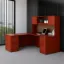 	L-shaped executive desk with hutch, laminate doors, double pedestals, file storage, reversible return, and fabric tack board