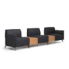Saxon 3-seat modular reception sofa with tall arms, two connector tables, built-in power outlets, soft cushioning, and upholstery options