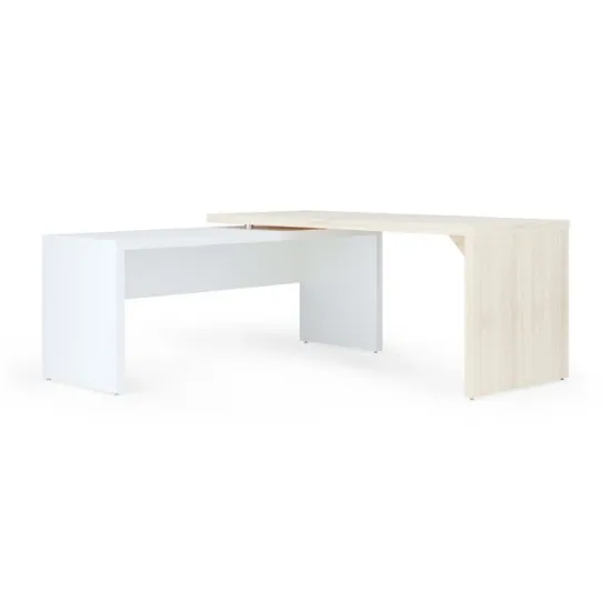 Modern L-shaped executive desk with reversible return, commercial laminate work surface, metal legs, and contemporary two-tone finish.