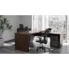 Modern L-shaped executive desk with reversible return, commercial laminate work surface, metal legs, and contemporary two-tone finish.