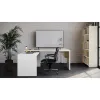 Modern L-shaped executive desk with reversible return, commercial laminate work surface, metal legs, and contemporary two-tone finish.
