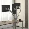 Triple monitor arm with USB-A and USB-C ports, clamp and grommet mounting, supporting three monitors up to 30 inches and 19.5 lbs. per arm.
