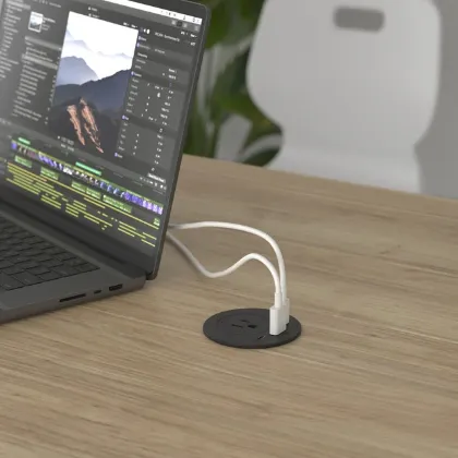 Black desktop power grommet with one AC outlet, USB-A, USB-C charging, USB-C data transfer, designed for standard office desk grommets.