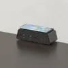 Desktop power module with integrated wireless phone charger, three AC outlets, USB-A, USB-C ports, and C-clamp mounting for office desks and conference tables.