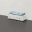 Desktop power module with integrated wireless phone charger, three AC outlets, USB-A, USB-C ports, and C-clamp mounting for office desks and conference tables.
