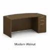 66-inch bow front executive desk with integrated 3 drawer pedestal in commercial laminate for executive and professional offices.