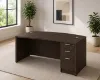 	66-inch bow front executive desk with integrated 3 drawer pedestal in commercial laminate for executive and professional offices.