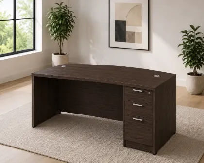	66-inch bow front executive desk with integrated 3 drawer pedestal in commercial laminate for executive and professional offices.