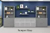 142-inch executive office storage wall with locking lateral file cabinets, open bookcases, and frosted glass door credenza in a commercial executive office
