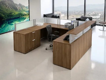 Commercial U-shaped reception desk with elevated transaction counter, frosted acrylic privacy panels, integrated storage, and modern laminate finish.