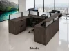 Commercial U-shaped reception desk with elevated transaction counter, frosted acrylic privacy panels, integrated storage, and modern laminate finish.
