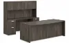 71-inch executive bow front desk with matching storage credenza, overhead hutch, and locking file drawers in a modern executive office.