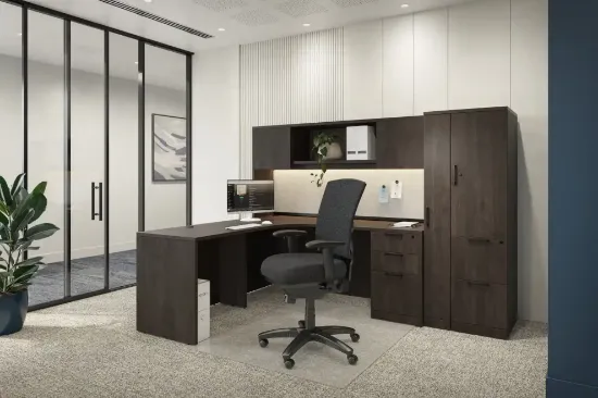 Executive L-shaped office suite featuring a bow front desk, overhead hutch, wardrobe storage cabinet, locking file drawers, and commercial laminate construction.