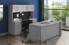 71-inch executive desk with matching storage credenza, glass door hutch, and locking file drawers in a modern executive office.