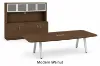 Modern executive conference table with powder-coated metal legs and matching storage credenza featuring a glass door hutch in a professional boardroom.