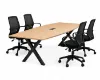 Executive boat-shaped conference table with powder-coated metal X base and Orion mesh conference chairs in a modern boardroom.