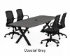 Executive boat-shaped conference table with powder-coated metal X base and Orion mesh conference chairs in a modern boardroom.