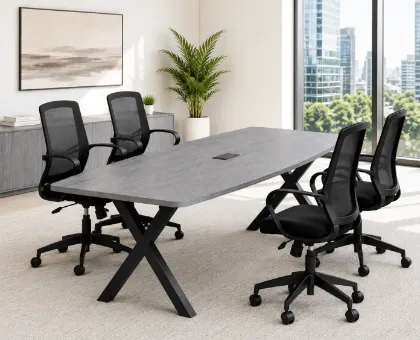 	Executive boat-shaped conference table with powder-coated metal X base and Orion mesh conference chairs in a modern boardroom.