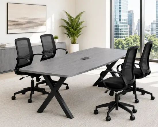 	Executive boat-shaped conference table with powder-coated metal X base and Orion mesh conference chairs in a modern boardroom.