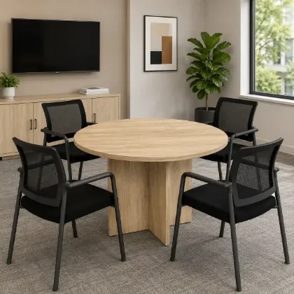 Round conference table with mesh back chairs for office meeting rooms