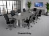 	Modern conference room furniture set with boat shaped conference table, locking storage credenza, and black leather conference chairs.