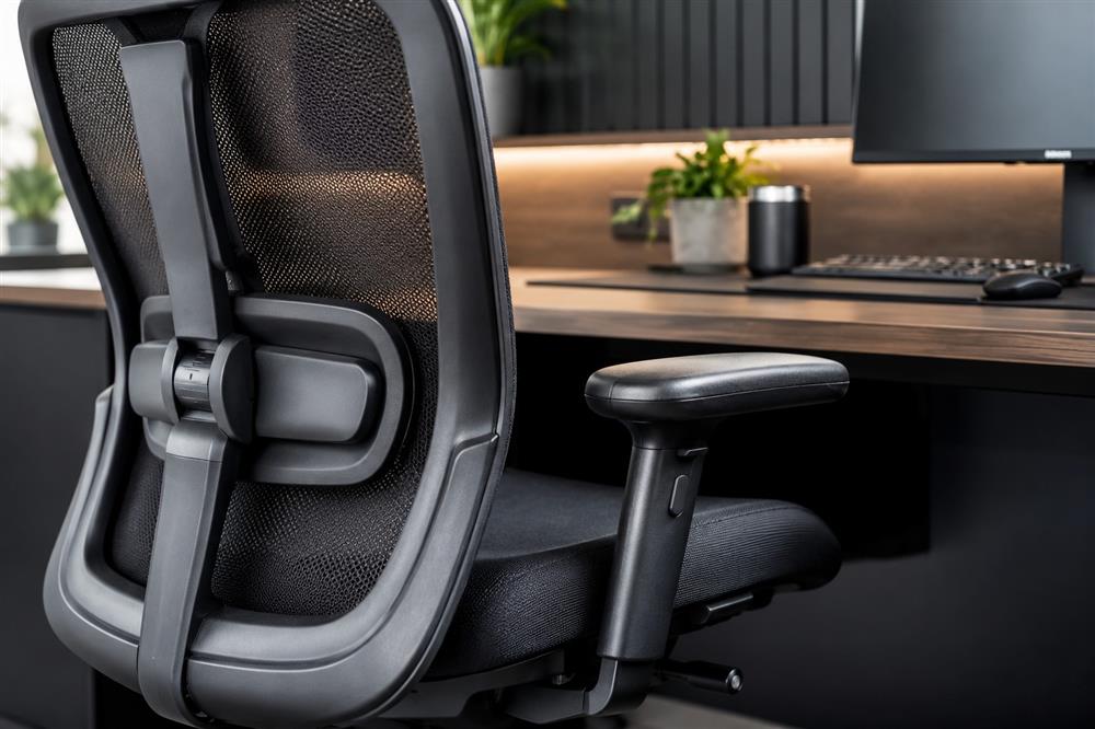 ergonomic office chair with adjustable lumbar support and modern workspace